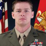 A Headshot Image of a Soldier With Two Flags Image