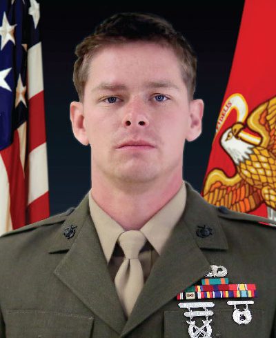 A Headshot Image of a Soldier With Two Flags Image